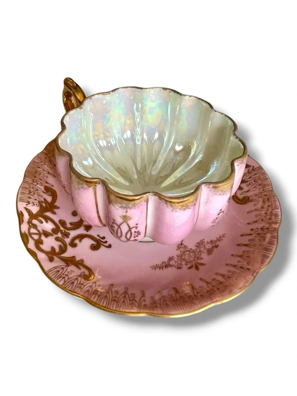Lusterware teacup & saucer, melon shaped cup on 3 gilded feet, iridescent